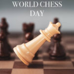 white chess queen falling on chess board world chess day .